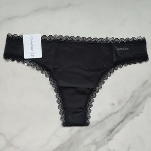 NWT CALVIN KLEIN FLIRTY MICRO THONG PANTY IN CK BLACK SIZE SMALL